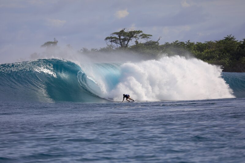 Tyler surfing a wave in the Mentawai Islands, Indonesia